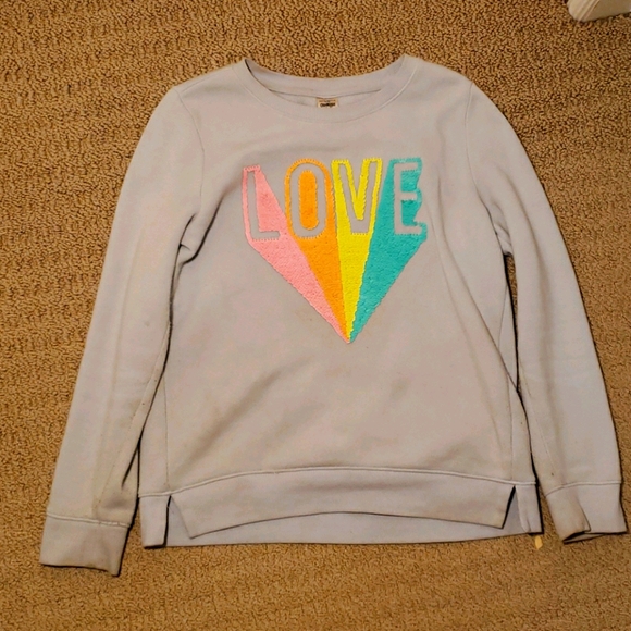 A sweater which has sequins on the front. - Picture 1 of 3